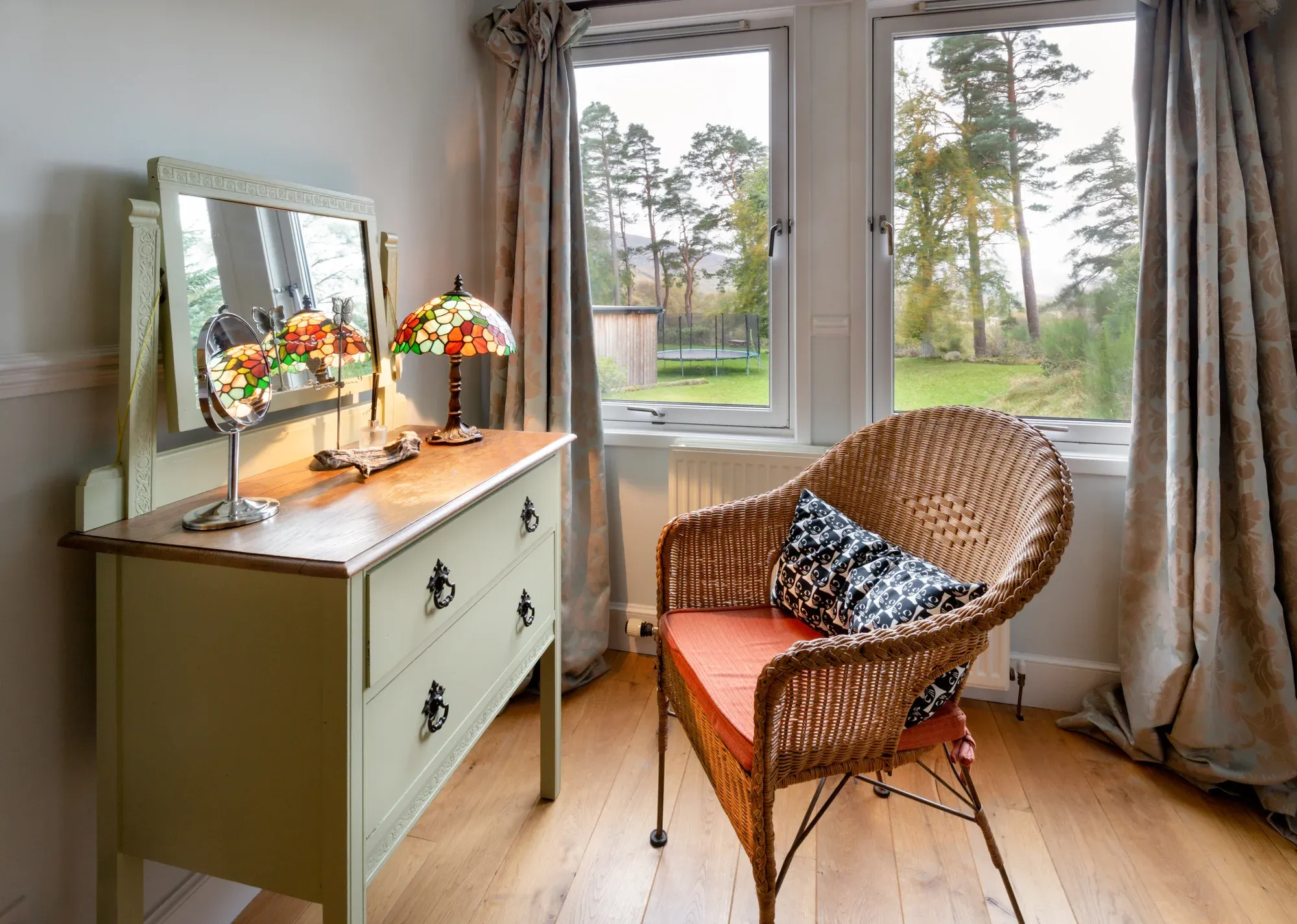 Spacious King Room view — windows overlooking the garden and pond